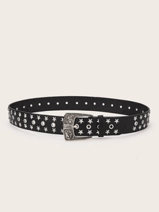 Detail of western vintage black leather belt with silver star studs and carved buckle