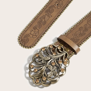 Ceinture en cuir marron avec motifs floraux gaufrés et boucle papillon ornée de strass