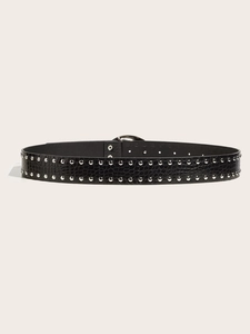 Close-up of black crocodile pattern belt with double-row silver metal studs and buckle