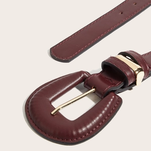 Vintage burgundy leather belt for women featuring gold buckle and rivet accents