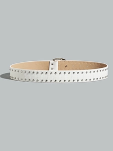 Close-up of white crocodile pattern leather belt with double rows of silver metal studs