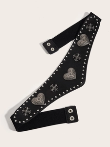 Detail of vintage black lace-up corset belt with heart studs and metal hardware