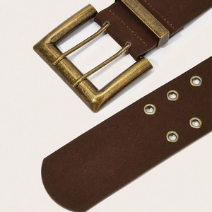 Macro view of wide vintage brown leather belt with bronze double pin buckle and metal eyelets