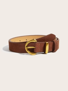 Close-up of dark brown suede leather belt with vintage gold horseshoe buckle and fine stitching