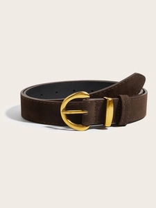 Detail of dark brown suede belt with vintage gold semi-circle buckle and metal loop