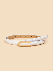 Close-up of white croc-embossed leather belt featuring a sleek U-shaped golden metal buckle