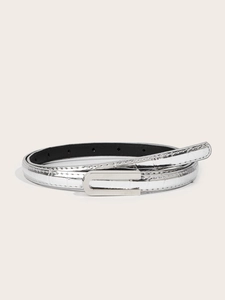 Detailed macro view of silver embossed leather belt with metal buckle and stitching