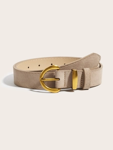 Close-up of beige suede wide belt with golden arched buckle and detailed stitching
