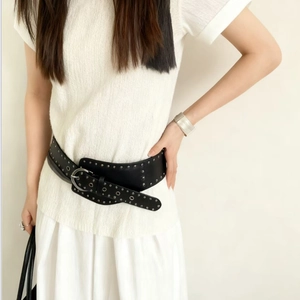 Fashionable black wide leather belt with silver rivets and large round metal buckle for women