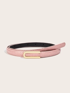 Close-up of pink leather belt with fine texture and minimalist gold U-shaped buckle