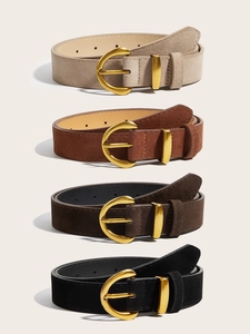 Detail view of four vintage suede waist belts in beige, tan, brown, and black with D-buckles