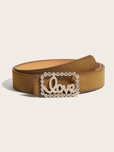 Close-up of brown suede belt featuring a rectangular rhinestone-encrusted Love buckle