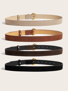 Vertical stack of four suede belts in beige, brown, and black with gold buckles