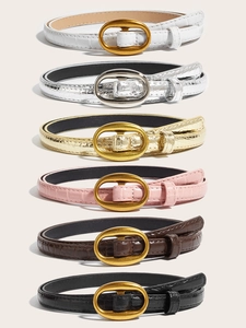 Set of six skinny faux crocodile leather belts with oval metal buckles in various colors