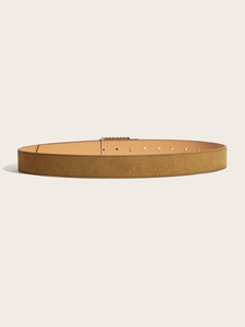 Detail of brown suede belt featuring reinforced stitching and adjustable metal pin holes