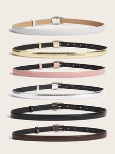 Vue détaillée de six ceintures fines en cuir motif crocodile avec boucles ovales
