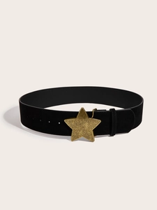 Close-up of a wide black vintage belt featuring a large distressed gold star-shaped buckle