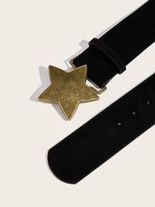 Detail of vintage matte black waist belt featuring a large bronze star buckle and adjustment holes