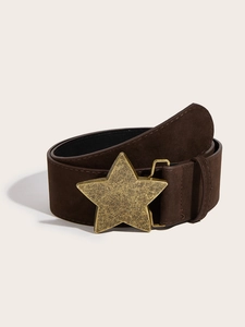 Close-up of vintage brown suede belt with a large golden star buckle and fine stitching