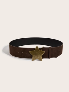 Detail of wide brown suede belt featuring a vintage gold star-shaped metal buckle
