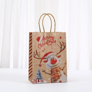 Detail showing cartoon reindeer print on brown kraft Christmas paper gift bag with rope handles