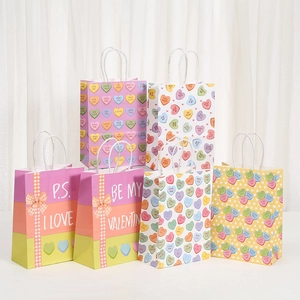 Five assorted Valentine kraft paper gift bags with P.S. I Love You and candy heart prints