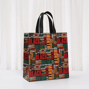 Detail of Black History Month non-woven tote bag with colorful African text print