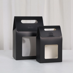Matte black gift boxes with transparent windows and integrated handles in two sizes