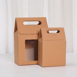 Detail of kraft paper gift boxes with window and handle in large and small sizes