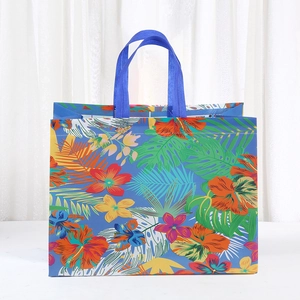 Blue non-woven tote bag with tropical floral pattern and large capacity design