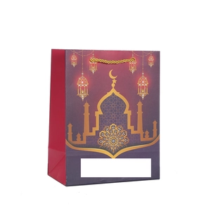 Sac cadeau festif violet avec silhouette de mosquée et anses dorées tressées