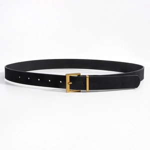 Detail view of black matte leather belt with brushed golden square buckle for jeans