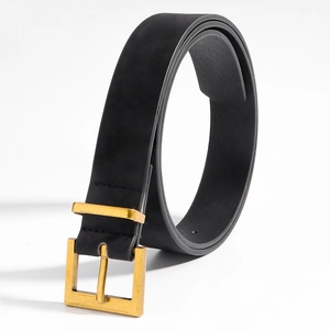 Detailed macro view of black leather belt with golden square pin buckle and stitching