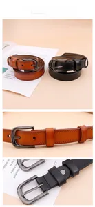 Detail of leather belt with star cutouts and a pin buckle in black and brown colors