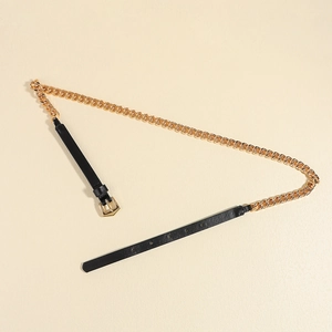 Detail of a chic punk-style belt with gold metal chain and black leather texture