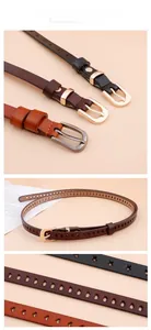 Detailed close-up of leather belts featuring star and heart hollow cutouts with metal buckles