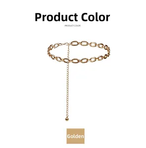 Macro detail of the golden metal body chain showing large oval links and glossy finish