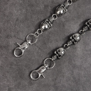 Detailed macro view of 3D skull punk wallet chain links with a metal lobster clasp