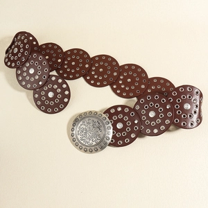 Vintage western wide belt with brown leather circles and silver floral buckle detail