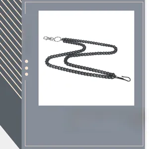 Detail of trendy black matte pants chain with silver spring clasps and metal rings
