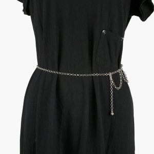 Close-up of silver metal waist chain with elegant layered links and polished ball pendant