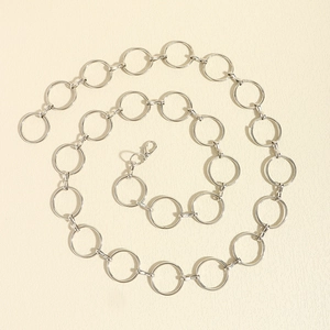 Detail of silver metal circle link waist chain with adjustable lobster clasp closure