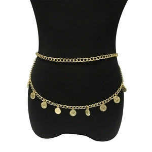 Close-up of golden double-layer waist chain with embossed coin pendants on black model