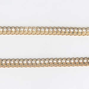 Elegant gold body chain for women featuring V-shaped metal links and sparkling rhinestones