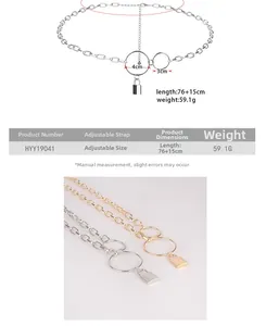 Detail view of punk style metal waist chain with lock pendant and adjustable link rings