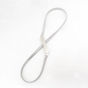 Macro detail of silver elastic spring metal belt with a smooth polished rectangle buckle