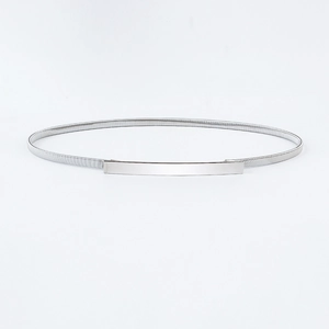 Close-up of polished silver metal buckle and elastic spring band for women belt