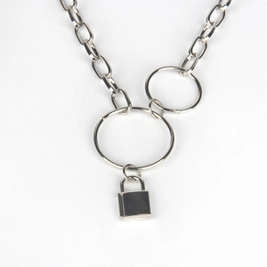 Close-up of silver metal chain belt with interlocking rings and a polished padlock pendant