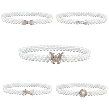 Detail of five elastic pearl waist belts with rhinestone bow and butterfly alloy buckles