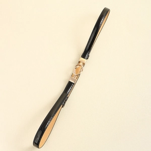 Minimalist black PU leather skinny belt for women with elegant gold metal buckle detail